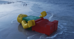 image of a Huge Lego Man Found on Beach