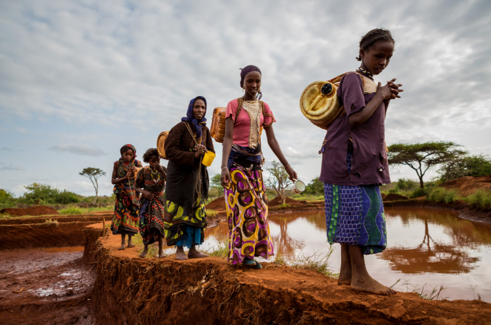 Ethiopian Girls Collecting rain water