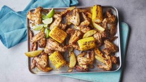 Piri-piri chicken wing, wedges and corn traybake