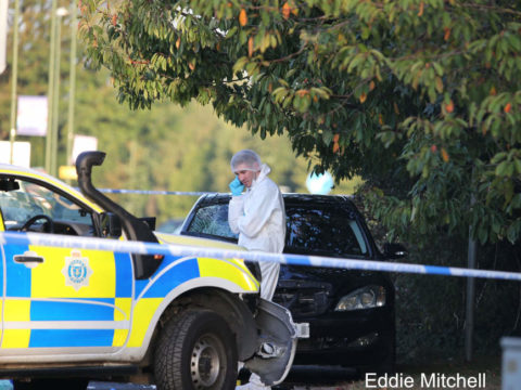 Man held after two police officers hit by car